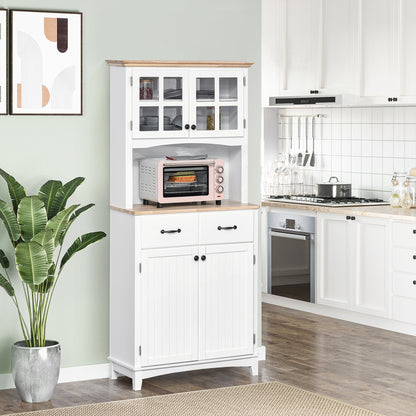 The kitchen furniture placed in a bright room with a microwave on the counter surface
