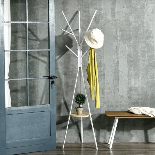 White metal coat rack with a hat and scarf hanging on it, placed in a hallway