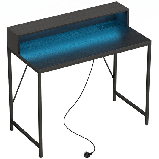 HOMCOM Gaming Desk with a black wood-effect finish and blue LED lighting on the monitor shelf