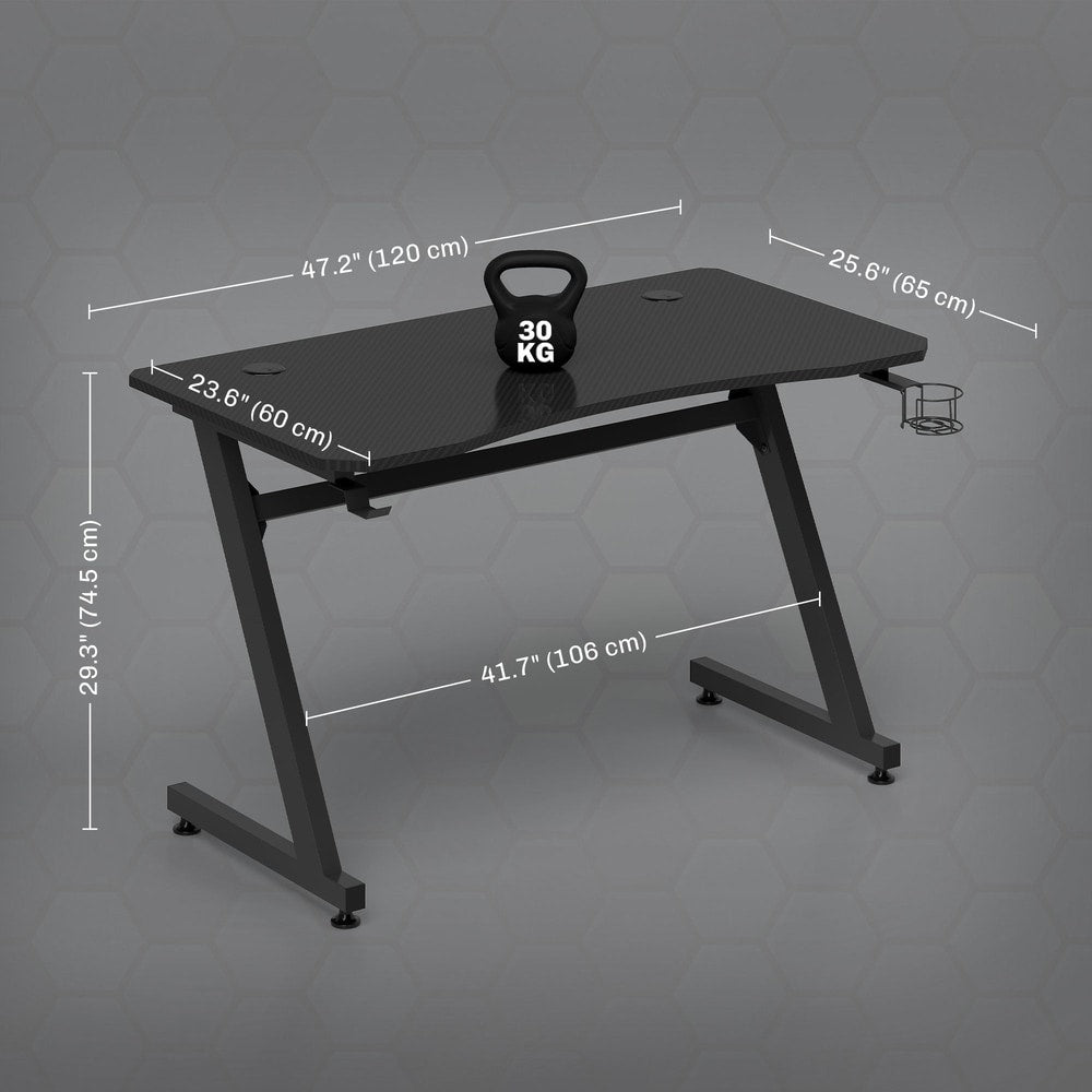 The gaming desk with dimensions and weight capacity shown