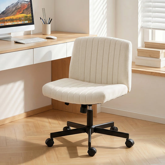 The armless office chair with wheels in cream, shown in a home office setting next to a desk