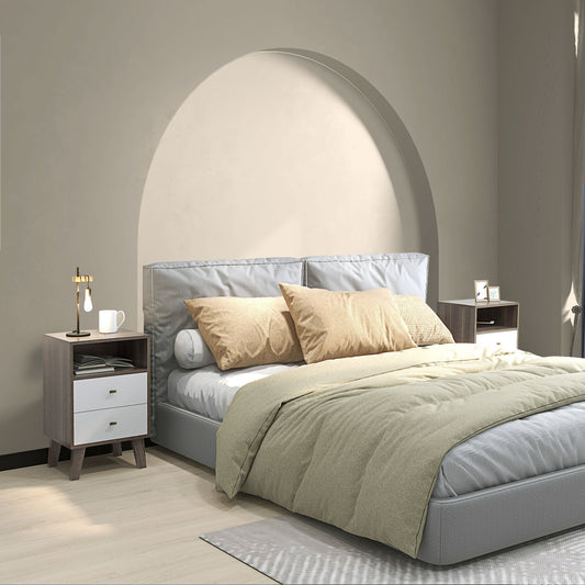 Two bedside tables in a bedroom setting next to a bed