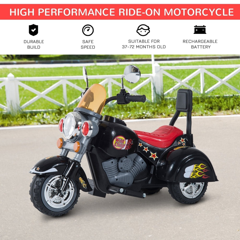 The black electric ride-on motorbike parked on a paved outdoor surface