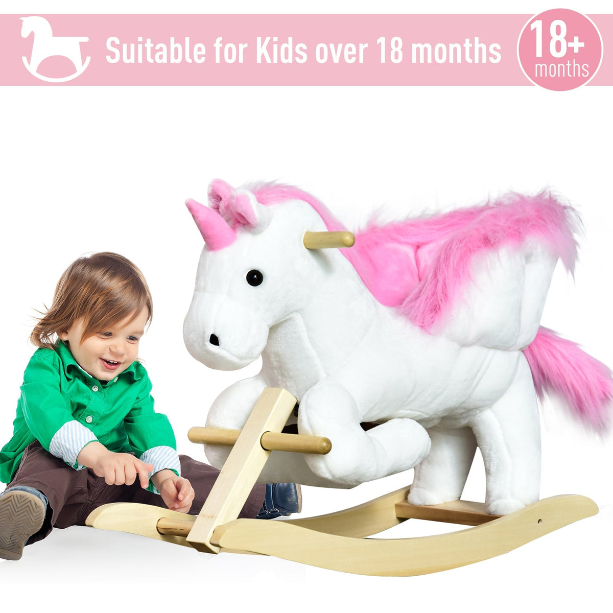 a young child sitting on the plush unicorn rocking toy in a bright studio setting