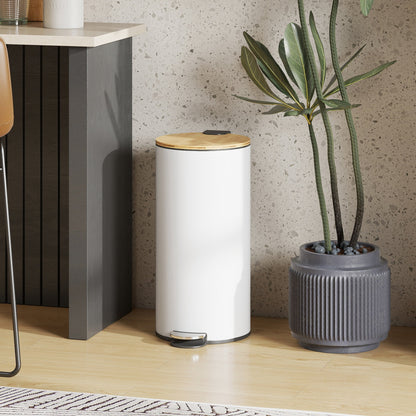 The white pedal bin with a natural wood lid is placed next to a kitchen counter