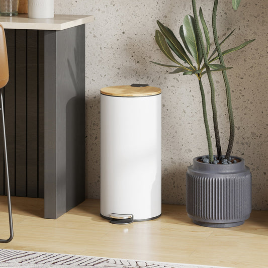 The white pedal bin with a natural wood lid is placed next to a kitchen counter