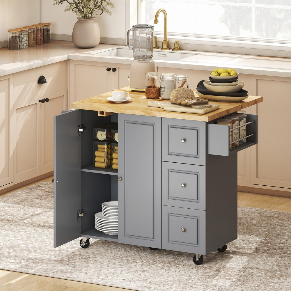 The kitchen island with its doors and drawers open, showing storage space inside