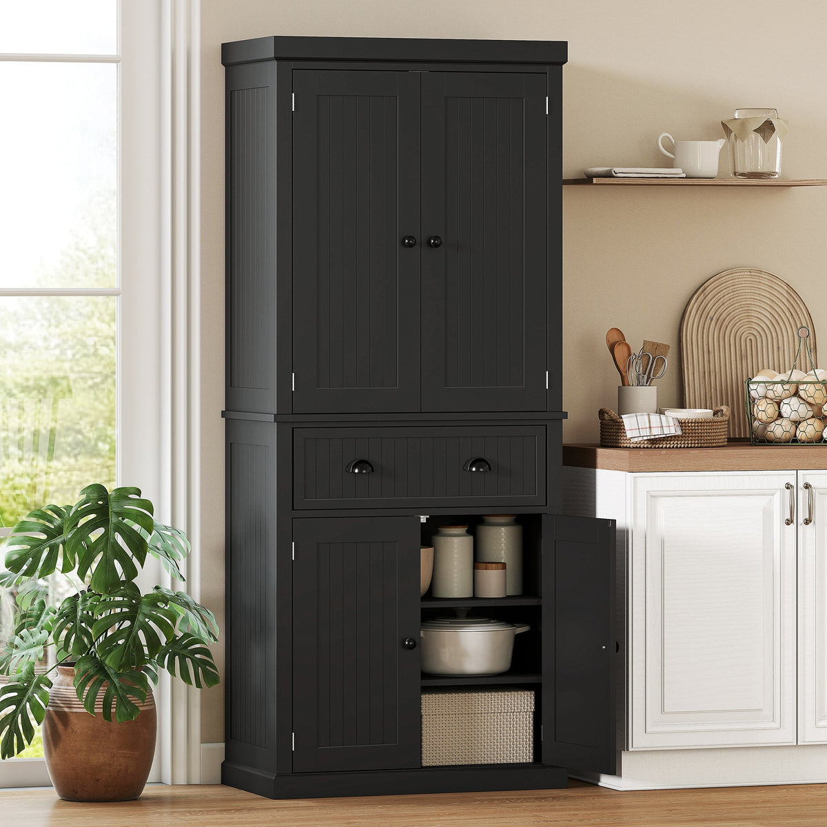 Black kitchen storage cabinet with drawer and adjustable shelves in a kitchen setting