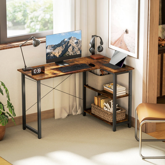 The corner desk set up in a home office with a computer monitor and accessories on the shelves