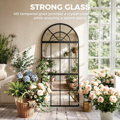 The large arched wall mirror with metal grid reflecting a garden scene, made with strong glass