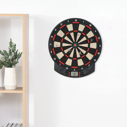 The electronic dartboard set mounted on a white wall in a room with a shelf and plant