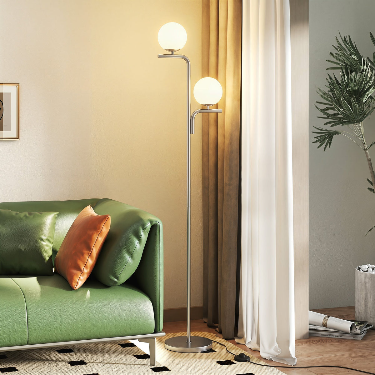 The standing lamp illuminated next to a green sofa in a modern living room setting