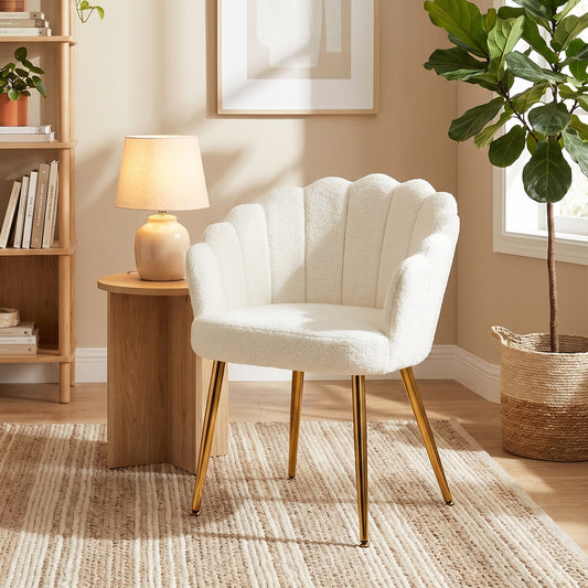 Cream boucle armchair with gold metal legs in a stylish living room setting