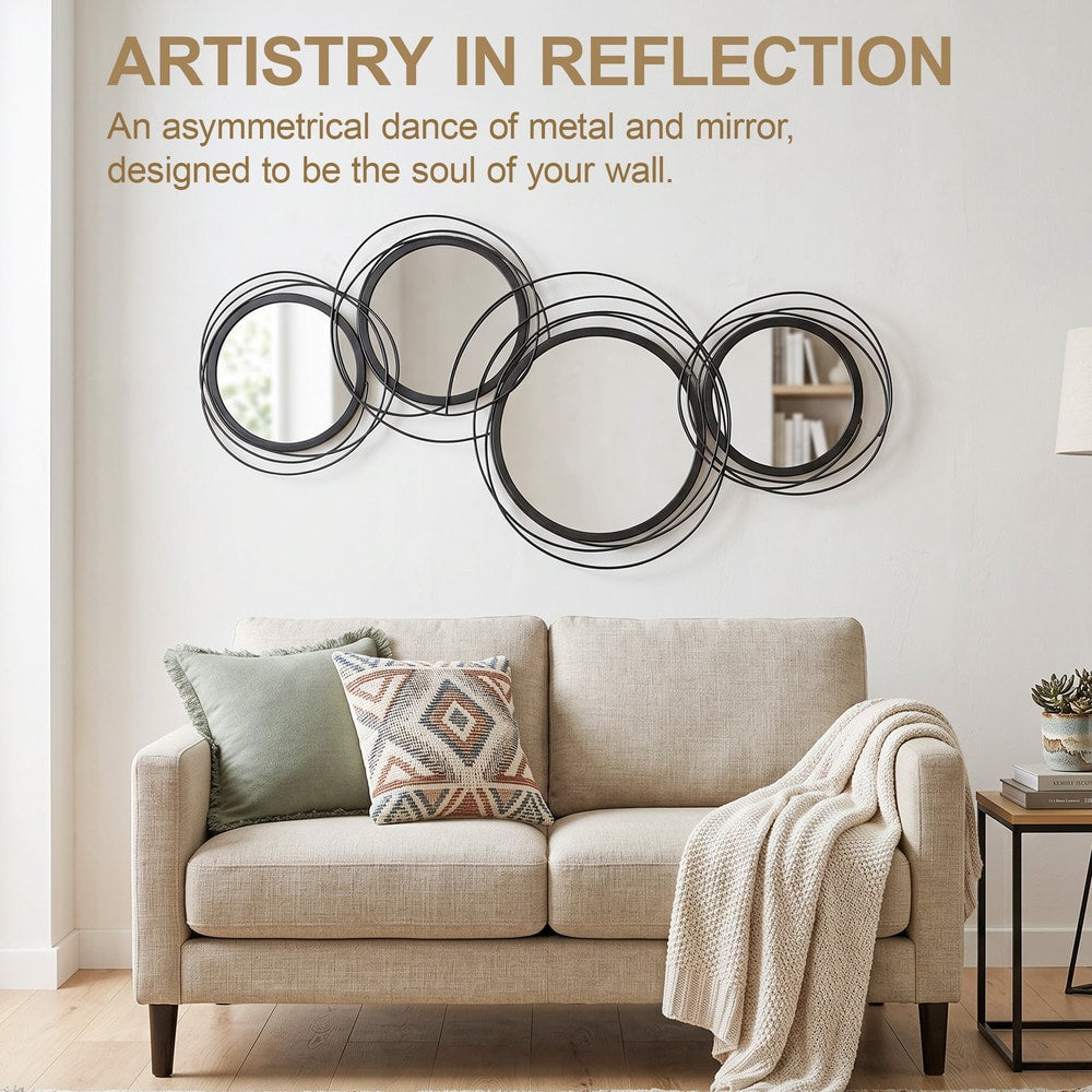 modern decorative mirror decor above a sofa with cushions and a throw