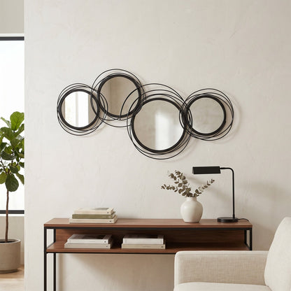 modern decorative mirror decor above a console table with books and a lamp