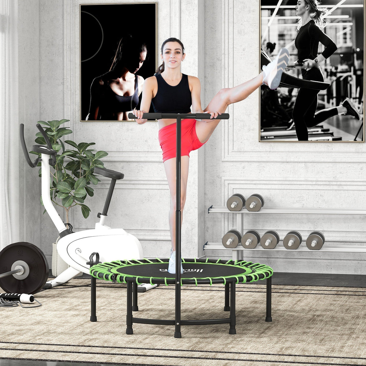 The fitness trampoline being used by a woman for a leg stretch exercise in a home gym setting