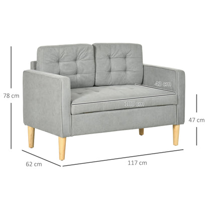 A light grey tufted cotton couch with dimensions labelled