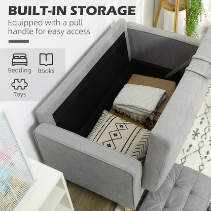 The light grey tufted cotton couch with its seat lifted to reveal hidden storage space inside