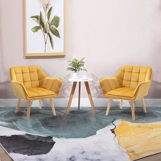 Two yellow accent chairs placed on either side of a small table in a living room setting
