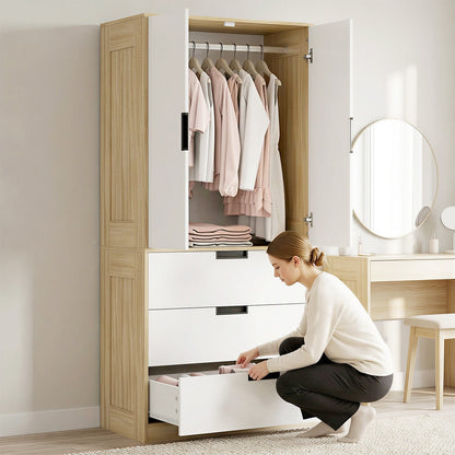 A woman using the oak and white wardrobe, opening a drawer to store clothes