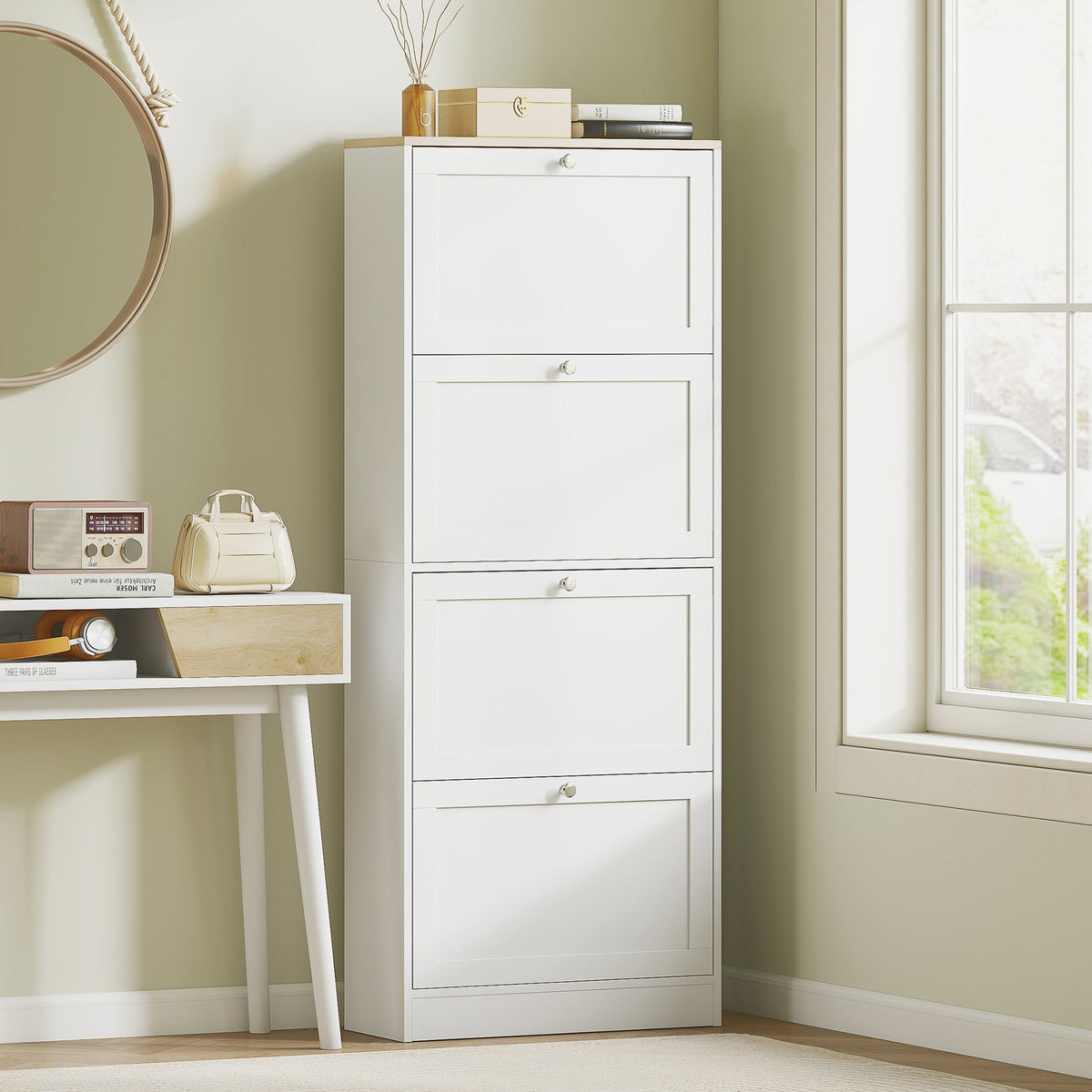 White shoe storage cabinet with four drawers standing next to a desk
