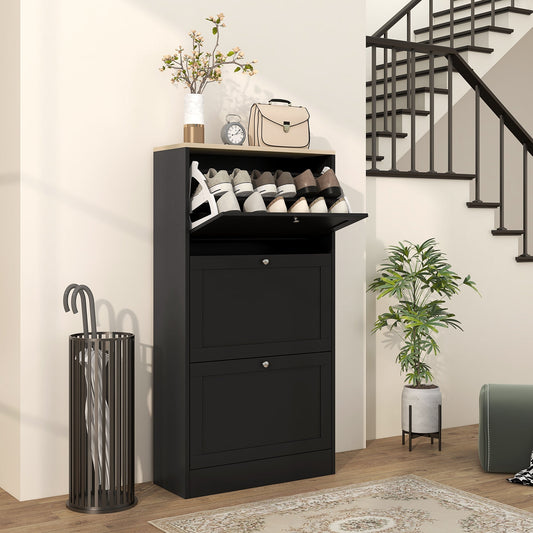 Black three-drawer shoe storage cabinet in a hallway next to a staircase and umbrella stand