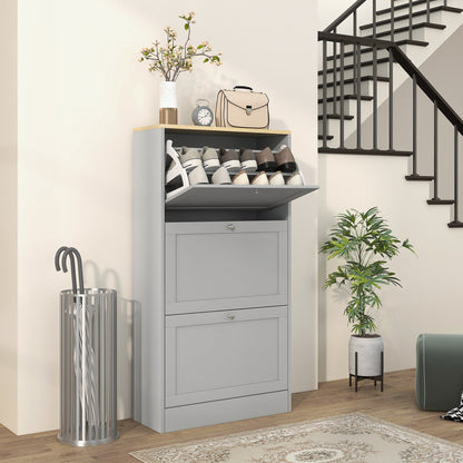 The shoe storage cabinet placed in a hallway with shoes inside the open top compartment