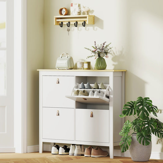 White shoe storage cabinet with a wood effect top in a hallway with shoes inside