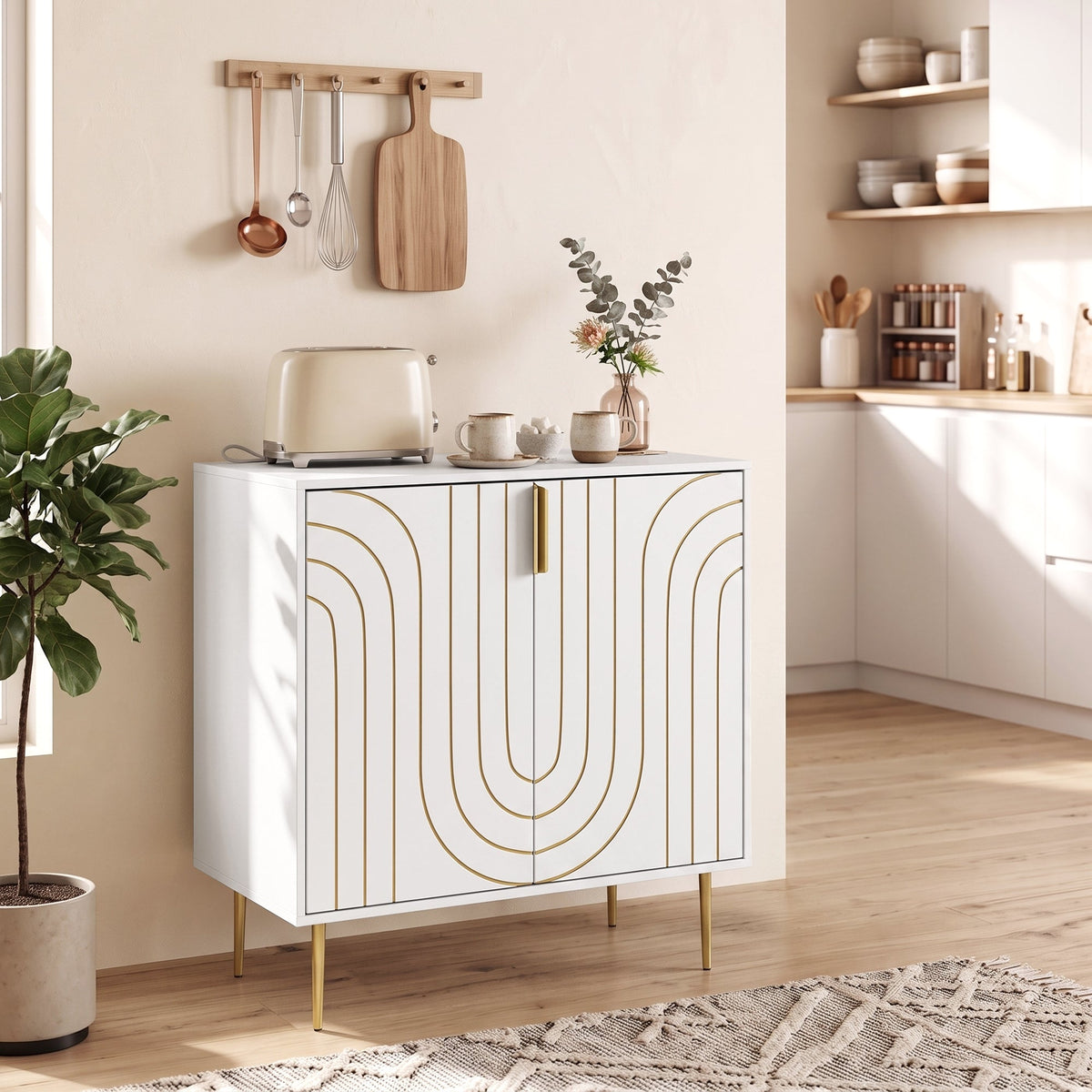 A white storage cabinet with gold curved line details stands in a kitchen setting with utensils and plants