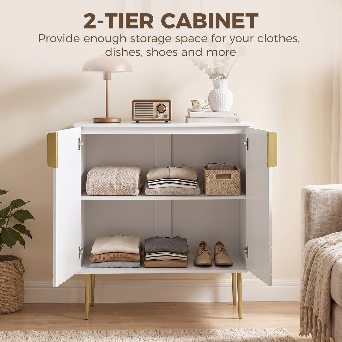 The white storage cabinet with gold curved line details is open, showing two shelves of folded clothes and shoes