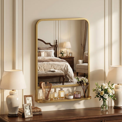 The wall mirror mounted above a wooden dresser with toiletries on the shelf