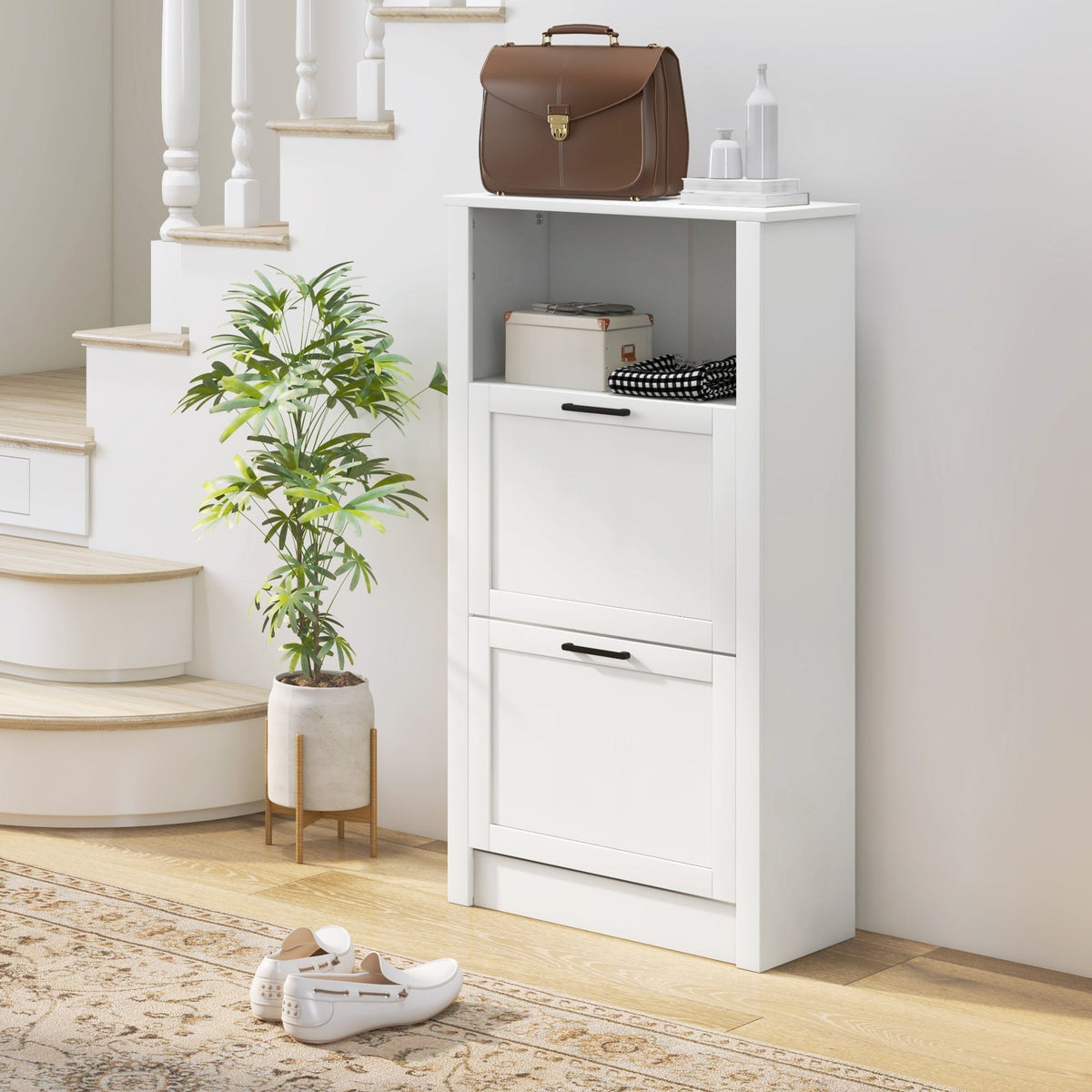 White shoe storage cabinet with two flip drawers and an open top compartment, styled in a hallway
