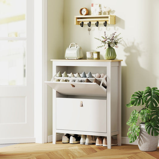 The shoe storage placed in a hallway corner filled with various pairs of shoes and decor items