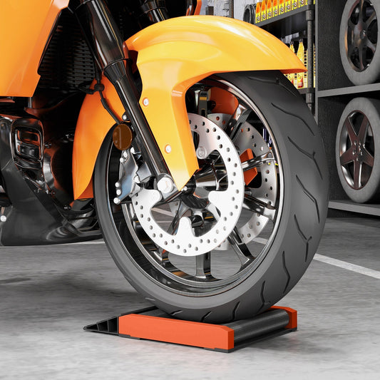 Motorcycle wheel resting on the orange and black wheel cleaning roller stand
