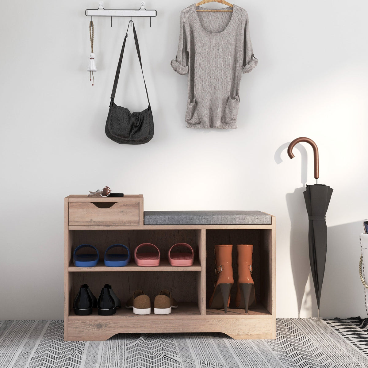 The shoe storage placed in a hallway with shoes on the shelves and an umbrella standing beside it