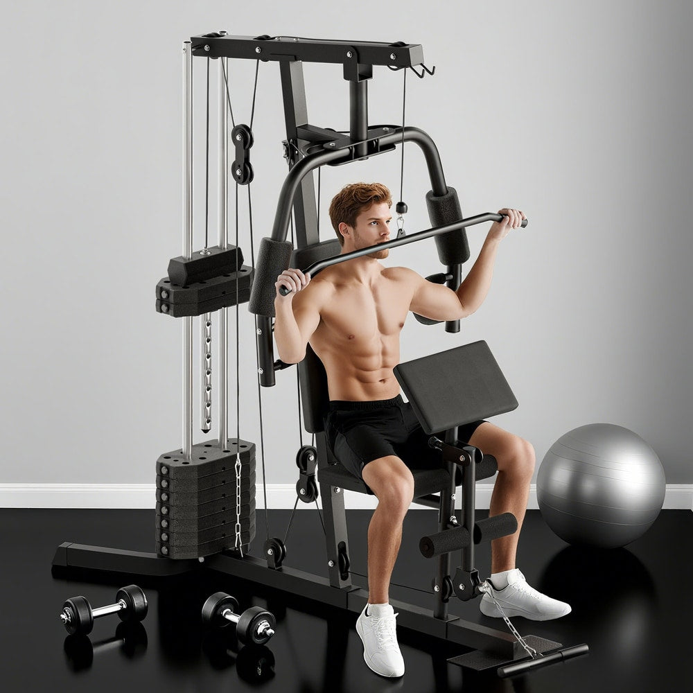 Man using the multi-exercise gym station for a lat pulldown exercise