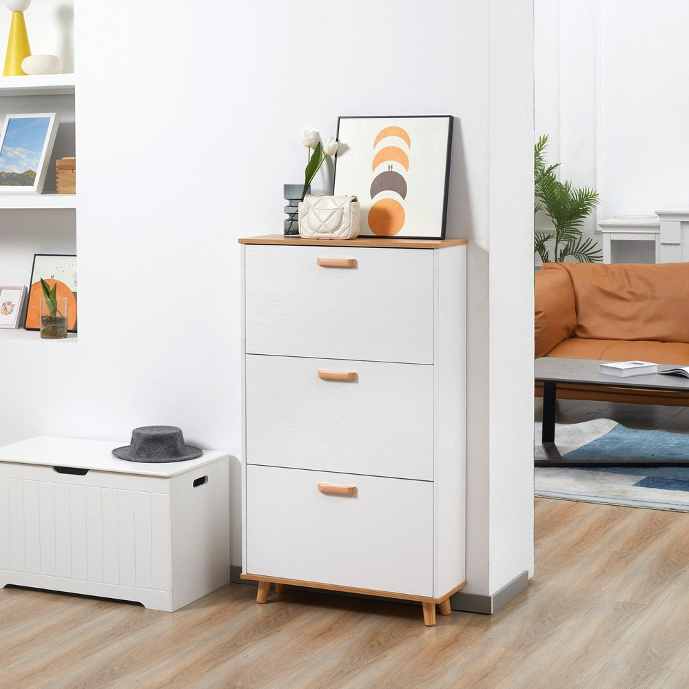 The slim shoe storage cabinet placed in a hallway next to a coat rack and a sofa