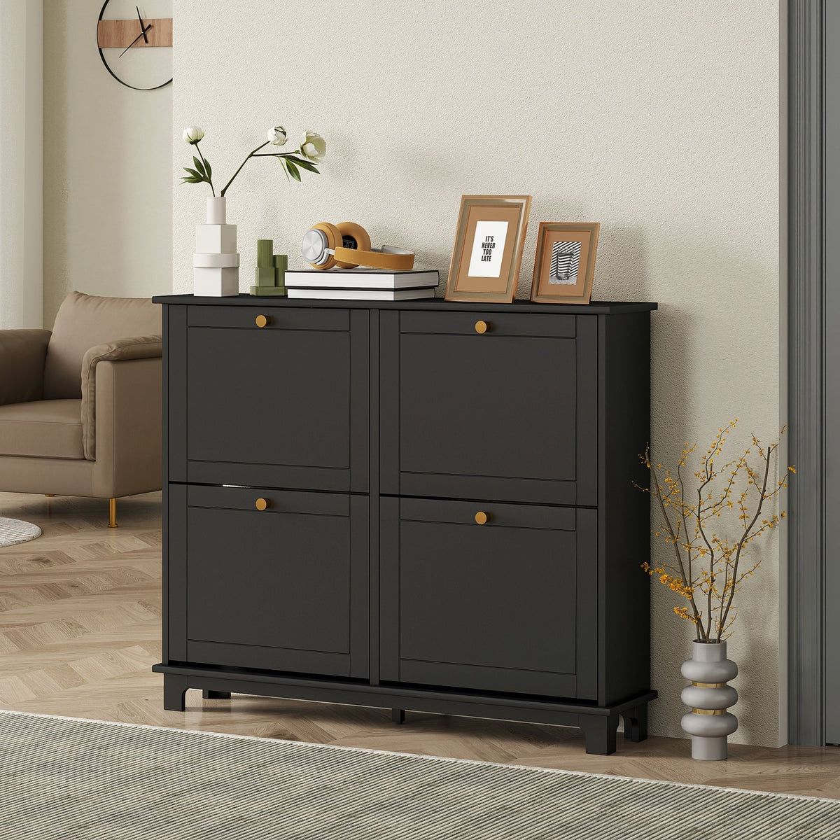 The black shoe storage cabinet in a living room setting with decorative items on top