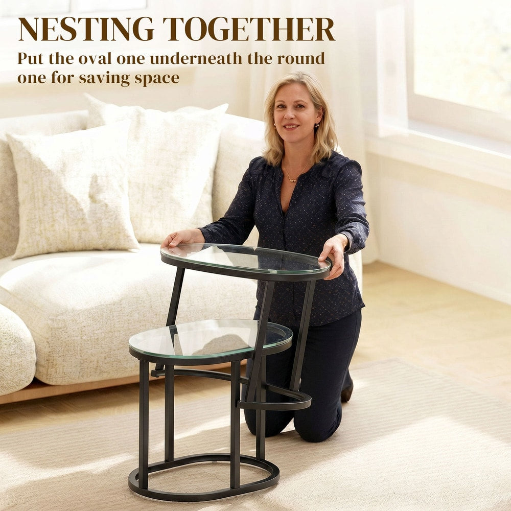 Woman demonstrating how the nesting coffee tables can be stored together to save space
