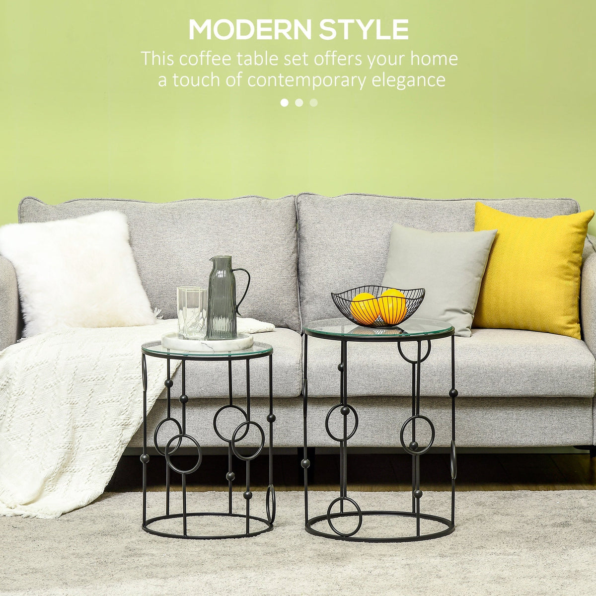 The round coffee tables styled in a living room with a vase and fruit bowl on top