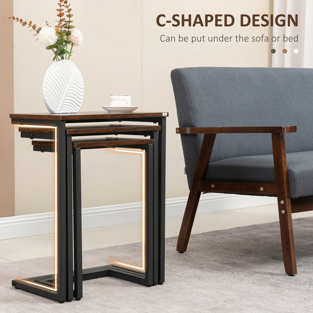 The side tables nested together with a glowing outline highlighting the c-shaped frame