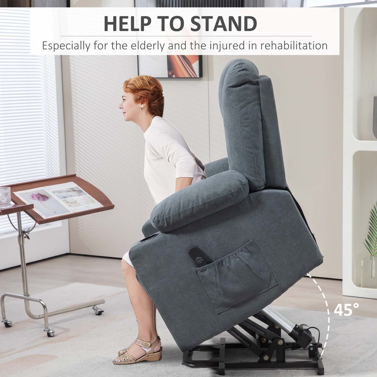 A woman uses the grey fabric riser and recliner chair to help her stand up