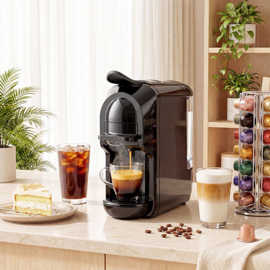 The small semi-automatic coffee maker in use on a kitchen counter, brewing coffee into a glass