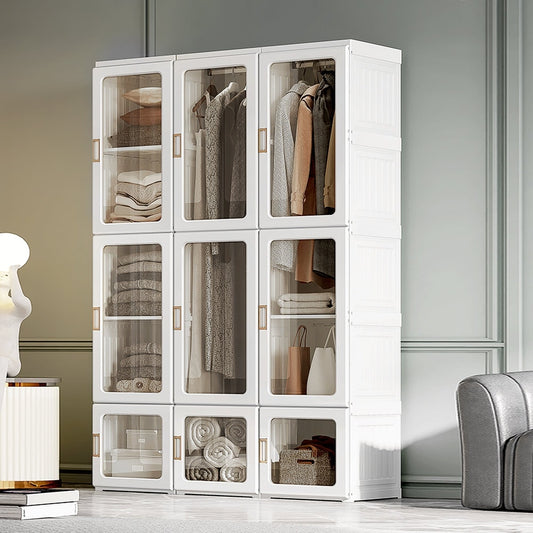The white wardrobe is shown in a room with clothes and folded items inside