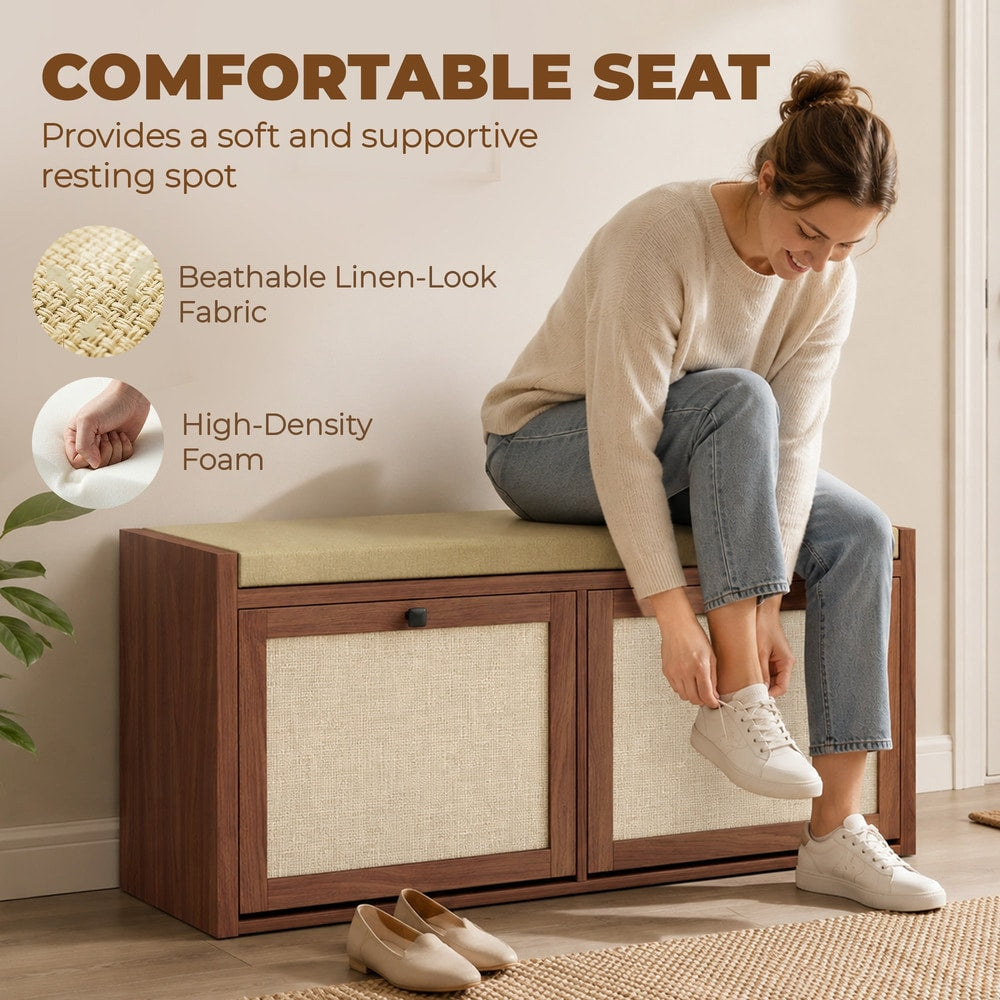 A woman sitting on the shoe storage bench, putting on her shoes