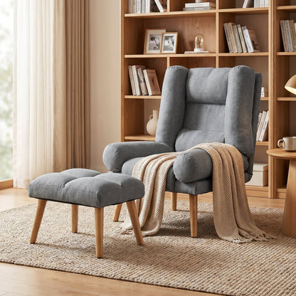 The grey recliner armchair and footstool placed in a cosy living room with a knitted throw