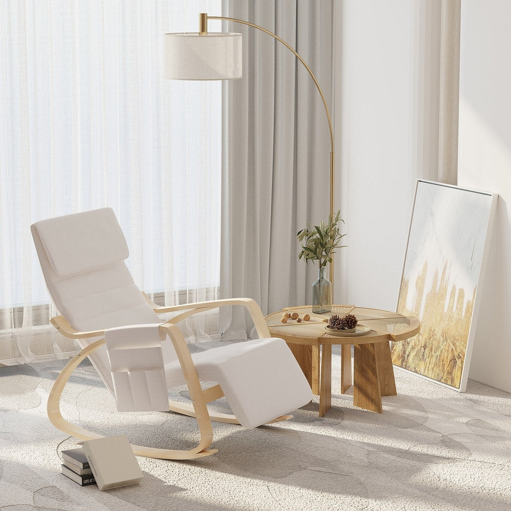 Cream white rocking lounge chair in a modern living room with a floor lamp and side table
