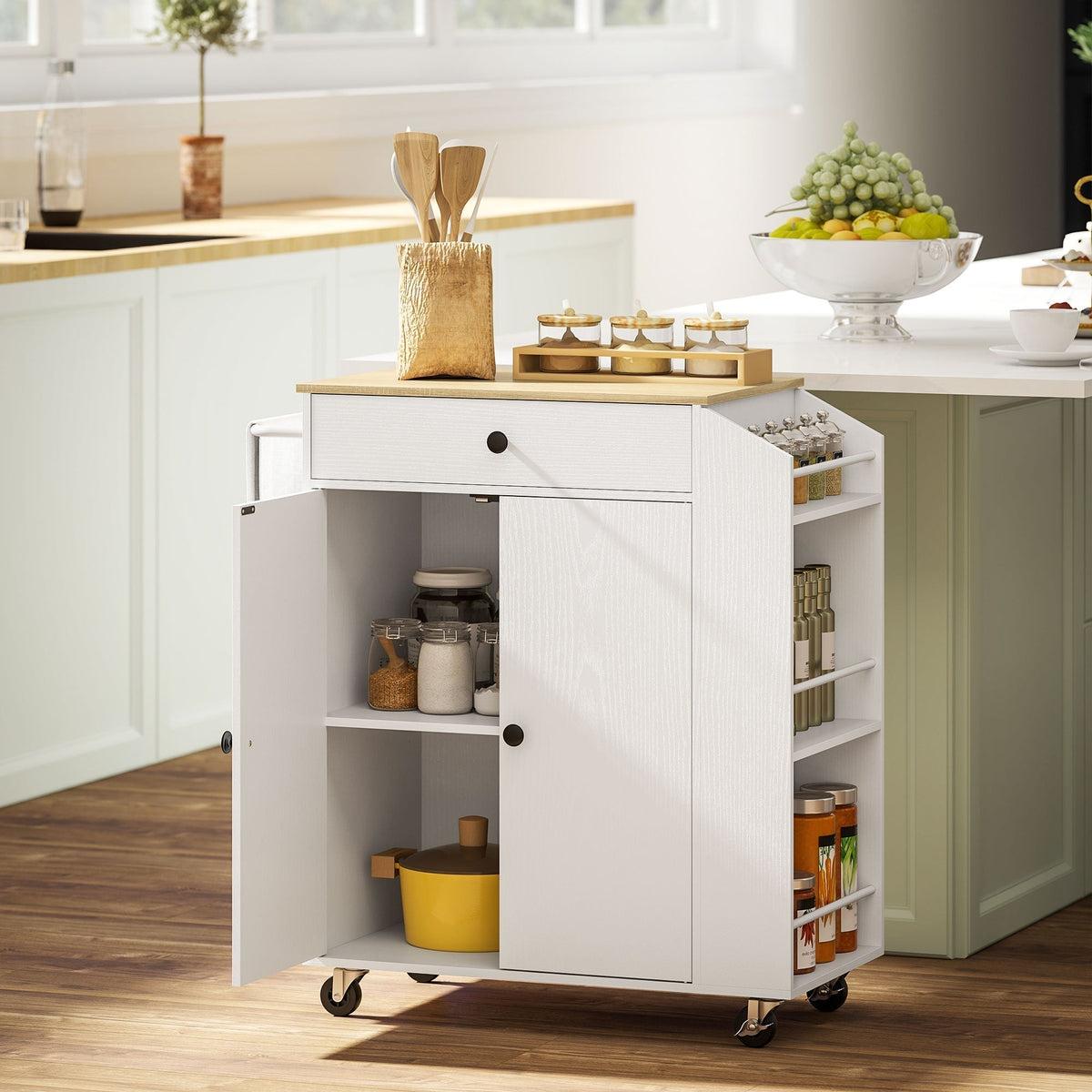 The white kitchen furniture with its doors open, showing storage inside and on the sides