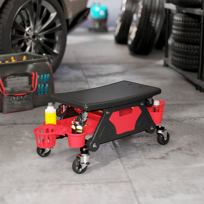 The rolling mechanic stool in a garage setting with car wheels nearby