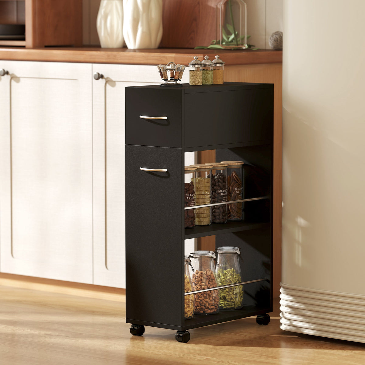 The kitchen cart trolley with a drawer and shelves filled with food items in a kitchen setting